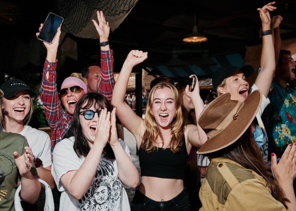 Disneyland visitors scream in excitement as Dwayne Johnson and Emily Blunt exit the Jungle Cruise ride.