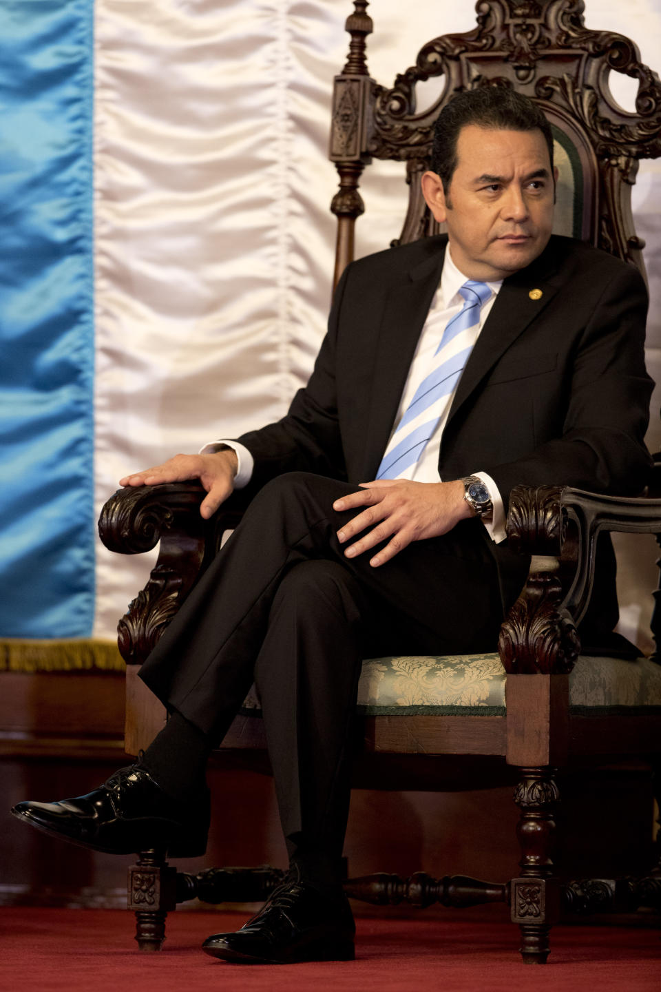 Guatemalan President Jimmy Morales attends a welcoming ceremony for ambassadors, in Guatemala City, Thursday, Jan. 10, 2019. Guatemala's Constitutional Court overruled Morales' decision after all-night deliberations on five appeals, blocking Morales' decision to unilaterally end a U.N. anti-corruption commission. (AP Photo/Moises Castillo)