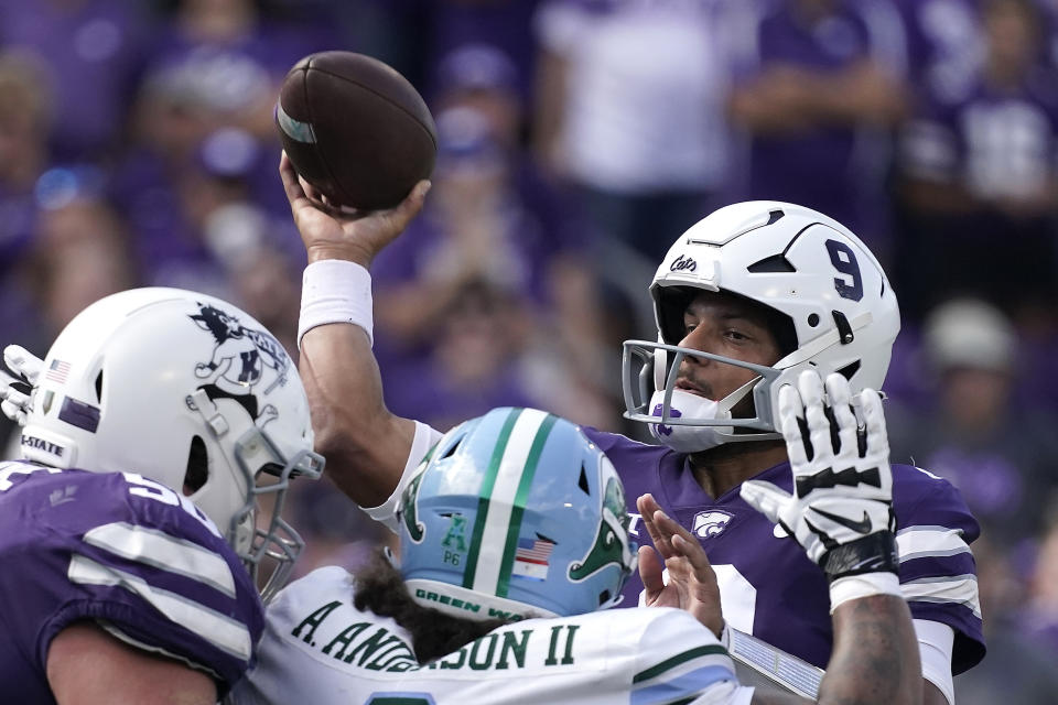 Kansas State quarterback Adrian Martinez (9) passes during the first half of an NCAA college football game against Tulane Saturday, Sept. 17, 2022, in Manhattan, Kan. (AP Photo/Charlie Riedel)