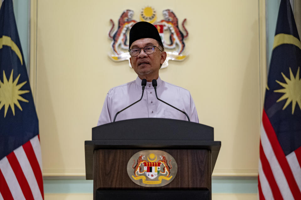 FILE - In this photo provided by Prime Minister Office, Malaysia's Prime Minister Anwar Ibrahim speaks at a press conference on his first day at the prime minister's office in Putrajaya, Malaysia, Nov. 25, 2022. Marking his first anniversary of coming to power, Malaysian Prime Minister Anwar admitted he was still struggling to win over ethnic Malay votes and acknowledged frustration over the slow pace of reforms. But he defended his unity government, saying it is now politically stable and able to fully focus on bolstering the economy and improving the people's welfare. (Prime Minister office via AP, File)