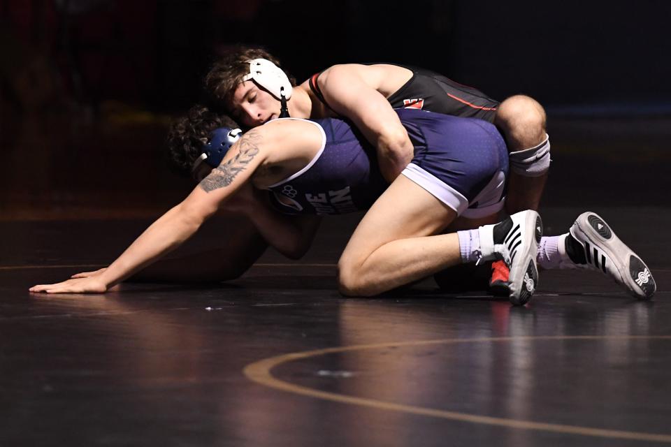 Pope John wrestling at Mount Olive on Thursday, April 1, 2021. Hunter Perez, of Mount Olive, and James Dacunto, of Pope John, in their 170 pound match. 