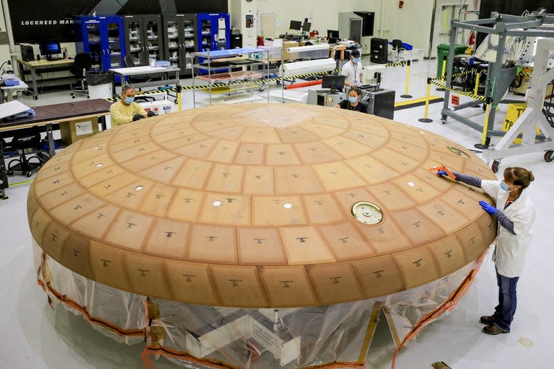 Engineering working on Orion’s Artemis 2 heat shield. 