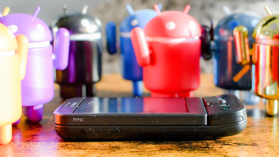 T-Mobile G1 phone with Android vinyl figurines