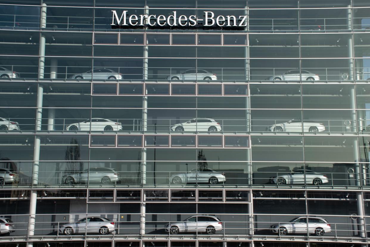 Munich, Germany - February 25, 2021: Cars for sale on display in the windows of the Mercedes-Benz building.
