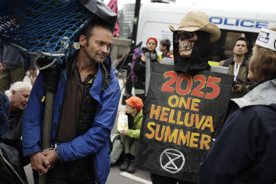 Climate protestors block Millbank in central London Monday, Oct. 7, 2019. (Photo: Matt Dunham/AP)