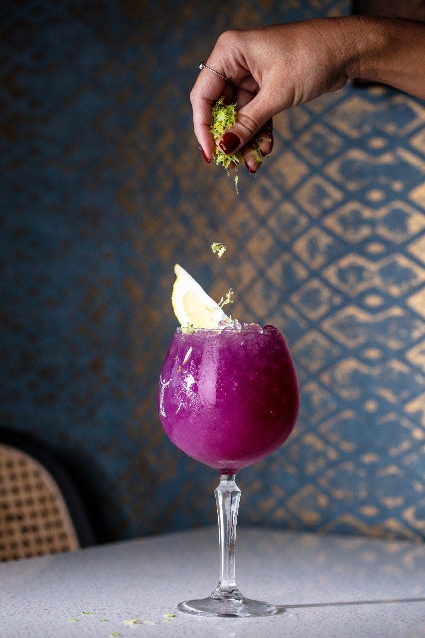 Refreshing sip: The Butterfly Effect mocktail is served at Ela Curry Kitchen in Palm Beach Gardens.