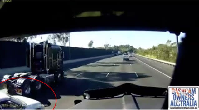 A white car can be seen to the left of screen preparing to merge into the lane where the truck was travelling. Picture: Dash Cam Owners Australia/Facebook