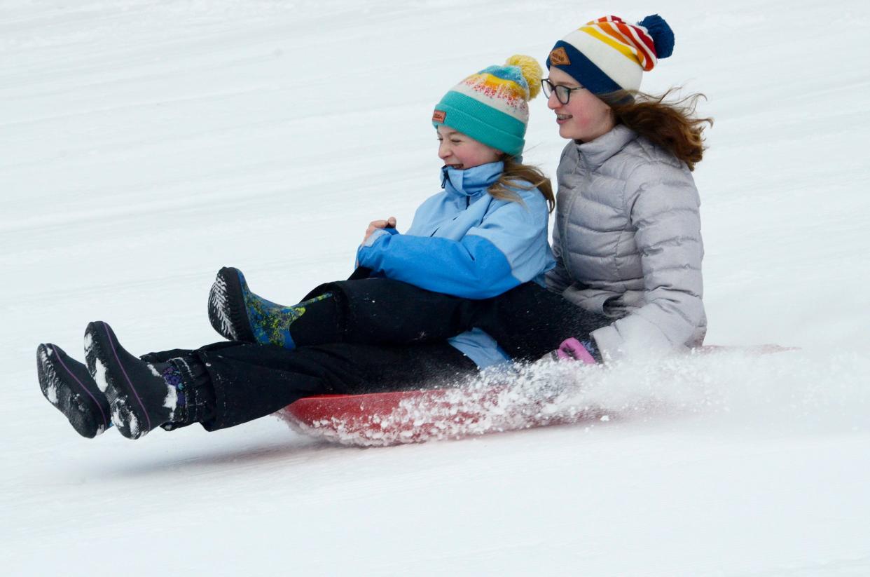 Greta and Elsa Meisel of Petoskey sled together on Saturday, Jan. 13, 2024 at the Winter Sports Park in Petoskey.