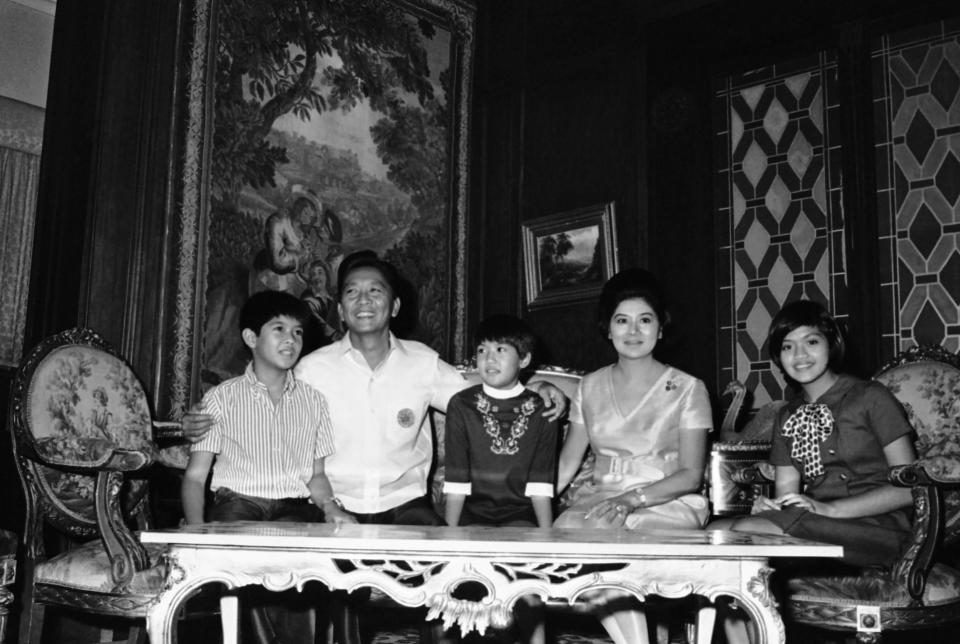 FILE - Philippines President Ferdinand Marcos and first lady Imelda sit with their children from left, Bongbong, Iren, and Immee, in November 1969, in Manila Philippines. Marcos Jr., son of the late dictator and his running mate Sara, who is the daughter of the outgoing President Rodrigo Duterte, are leading pre-election surveys despite his family's history. (AP Photo, File)