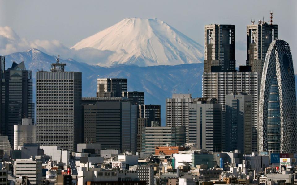 Japan's highest peak Mount Fuji is visible through Tokyo's Shinjuku skyscrapers - KIMIMASA MAYAMA/EPA-EFE/REX 
