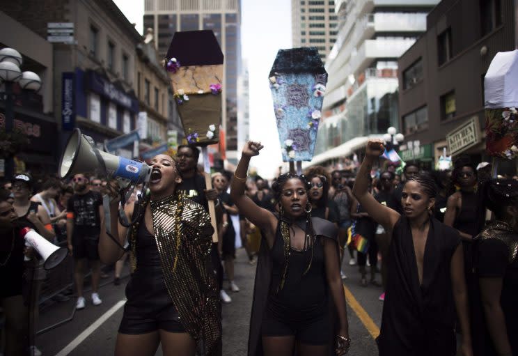 Members of Toronto's Black Lives Matter chapter shutdown the Pride parade in July. On Tuesday, Pride voted to approve the demands the group made at the time, including banning police floats. Photo from The Canadian Press