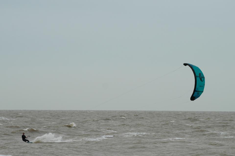 Wind surfers on the sea as they take advantage of strong winds near Clacton-on-Sea, England (AP)