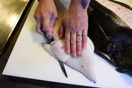 Chef Christopher Haatuft prepares a halibut at his restaurant Lysverket in Bergen, Norway, July 31, 2018. Picture taken July 31, 2018. Clodagh Kilcoyne