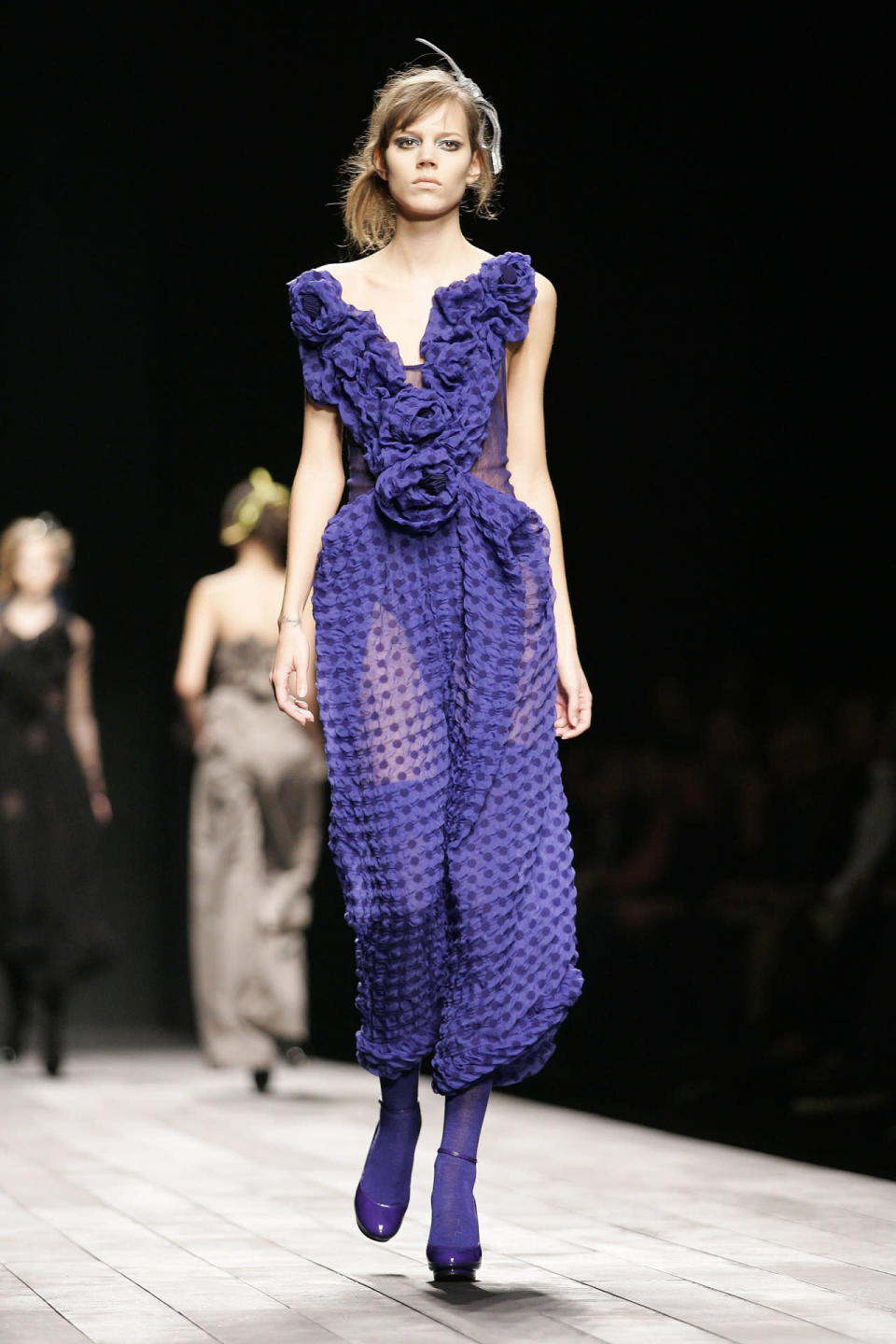 A model wears a purple dress (and purple everything else) at Sonia Rykiel’s fall 2007 show in Paris.