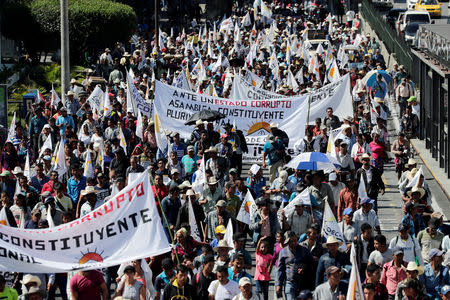 People march to demand the resignation of Guatemala's President Jimmy Morales in Guatemala City, Guatemala September 12, 2018. REUTERS/Luis Echeverria