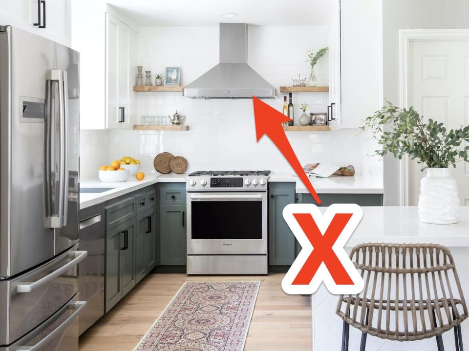 red arrow and x pointing at an exposed stove hood in a modern kitchen