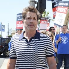 Rob Lowe shows his support for the WGA as they picket