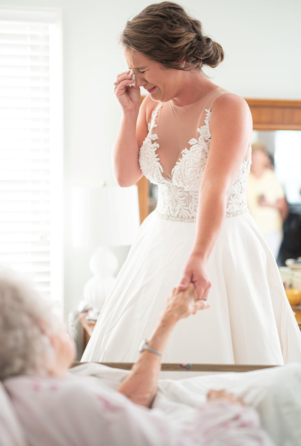 The emotional moment a dying grandmother sees her granddaughter as a bride. (SWNS)