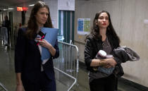Elizabeth Entin, right, a witness in the Harvey Weinstein rape and sexual assault trial, walks towards the courtroom with Assistant District Attorney Meghan Hast Tuesday, Jan. 28, 2020 in New York. (AP Photo/Craig Ruttle)