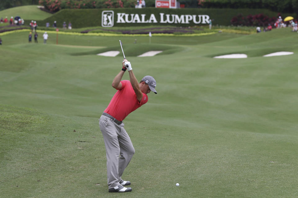 Justin Thomas of the United States of America plays his shot on the tenth hole during final round of the CIMB Classic golf tournament at Tournament Players Club (TPC) in Kuala Lumpur, Malaysia, Sunday, Oct. 14, 2018. (AP Photo/Vincent Phoon)