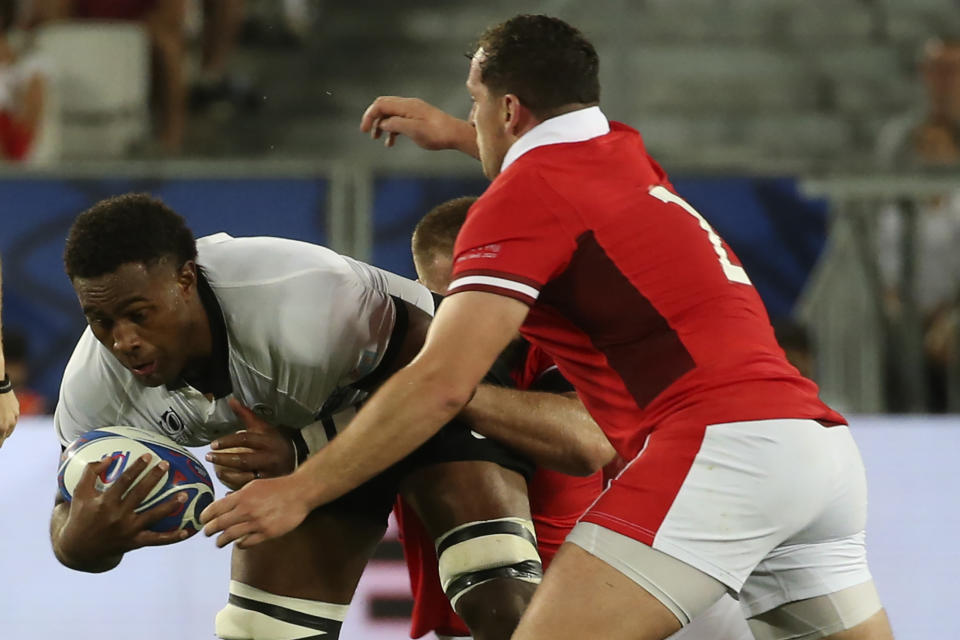 Fiji's Viliame Mata is tackled during the Rugby World Cup Pool C match between Wales and Fiji at the Stade de Bordeaux in Bordeaux, France, Sunday, Sept. 10, 2023. (AP Photo/Bob Edme)