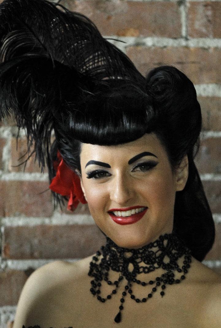 In this March 5, 2012, photo, a model who goes by the name of "Vita Devoid" poses for a photo before an internet pinup show at an Ybor City studio in Tampa, Fla. (AP Photo/Chris O'Meara)