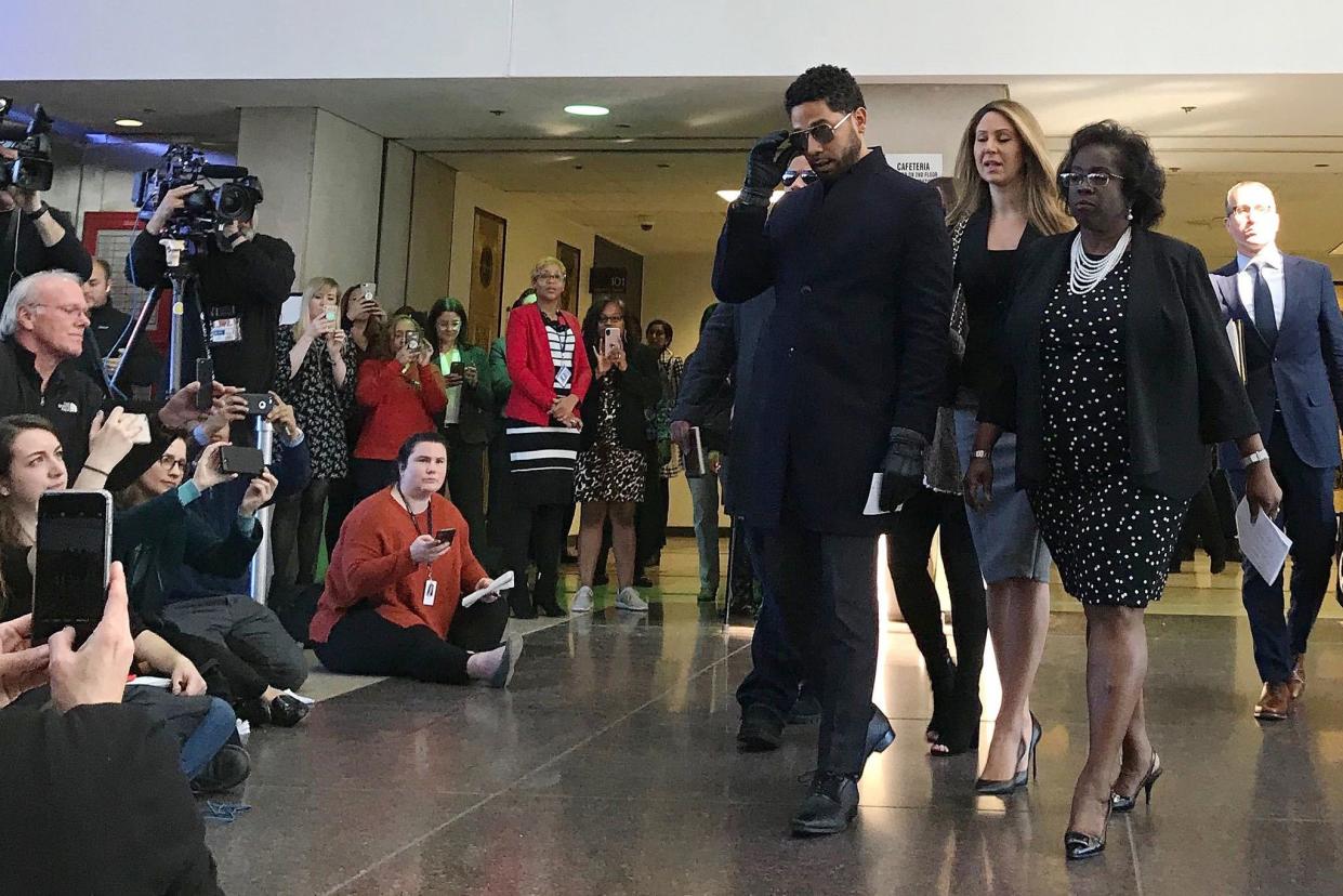 Empire actor Jussie Smollett arrives for a news conference after a hearing at the Leighton Criminal Court Building Tuesday, Mar. 26, 2019, in Chicago. Smollett's attorneys Tina Glandian and Patricia Brown Holmes said in a Tuesday morning statement that Smollett's record "has been wiped clean." Smollett was indicted on 16 felony counts related to making a false report that he was attacked by two men who shouted racial and homophobic slurs.