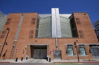 FILE - This March 21, 2020, file photo, shows the Maricopa County 4th Avenue Jail in downtown Phoenix. The number of inmates in Arizona's prisons and in some county jails in the state have decreased since the start of pandemic. The decrease reflects a slowdown in the state's court system that has held far fewer criminal jury trials over the last year as it took steps to prevent the coronavirus from spreading at courthouses. (AP Photo/Ross D. Franklin, File)