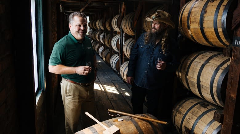 Harlen Wheatley and Chris Stapleton drinking whiskey in a distillery