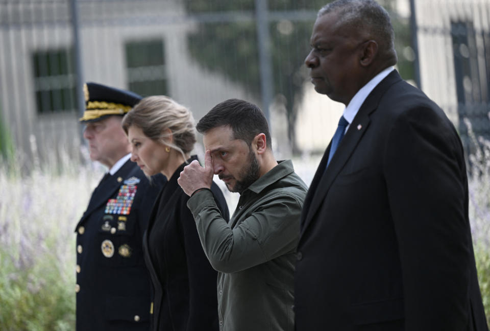 Defense Secretary Lloyd Austin, right, Chairman of the Joint Chiefs of Staff Gen. Mark Milley, left, with Zelensky and his wife Olena Zelenska at the 9/11 Pentagon Memorial