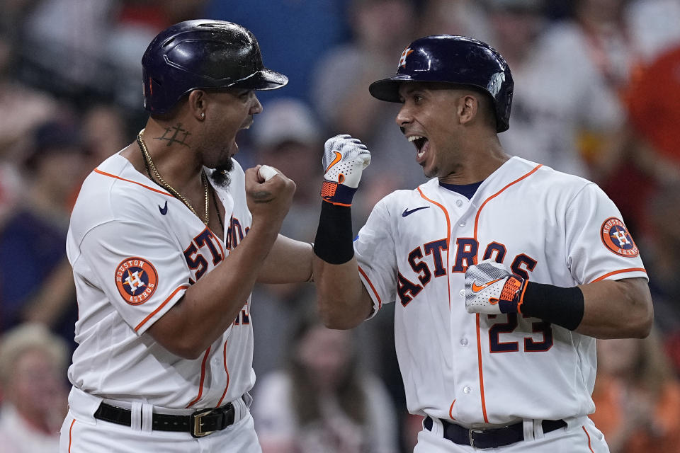 Houston Astros' Michael Brantley, right, celebrates with Jose Abreu after hitting a two-run home run against the New York Yankees during the second inning of a baseball game Saturday, Sept. 2, 2023, in Houston. (AP Photo/Kevin M. Cox)