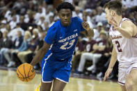 Hofstra guard Tyler Thomas (23) dribbles while guarded by Charleston guard Reyne Smith (2) during the second half of an NCAA college basketball game, Saturday, Jan. 28, 2023, in Charleston, S.C. (AP Photo/Stephen B. Morton)