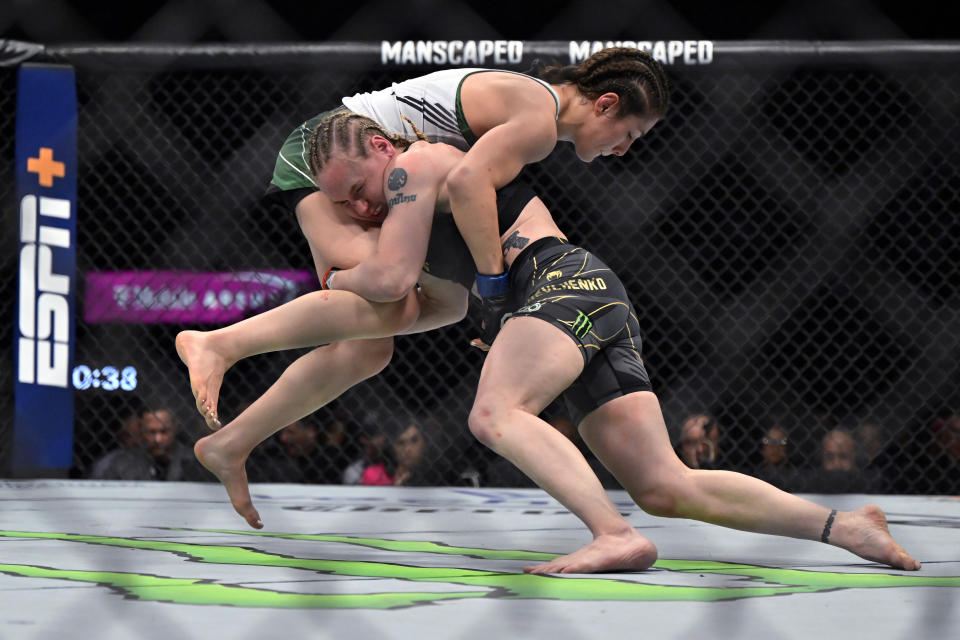 Alexa Grasso, left, and Valentina Shevchenko compete in a UFC 285 mixed martial arts flyweight title bout Saturday, March 4, 2023, in Las Vegas. (AP Photo/David Becker)
