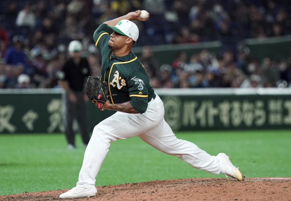 Oakland Athletics closer Frankie Montas pitches against the Nippon Ham Fighters in the ninth inning in their pre-season exhibition baseball game at Tokyo Dome in Tokyo Sunday, March 17, 2019. The Athletics won 5-1. (AP Photo/Eugene Hoshiko)