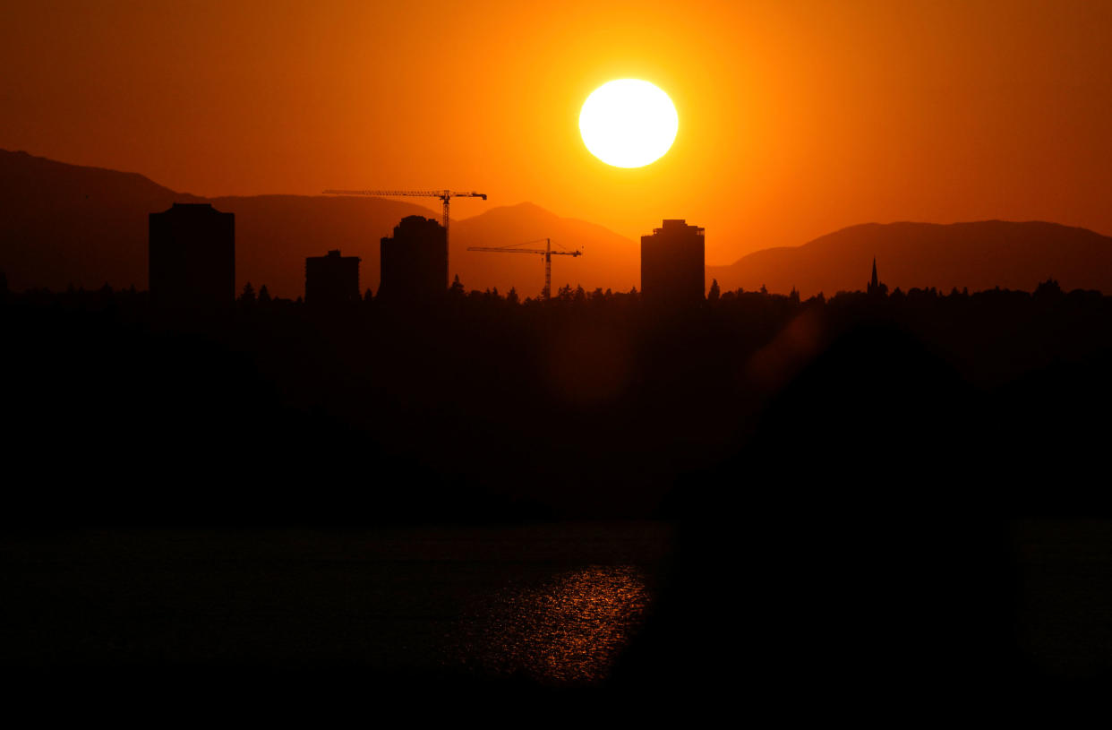 The sun sets over the University District in Seattle, on May 13, 2023