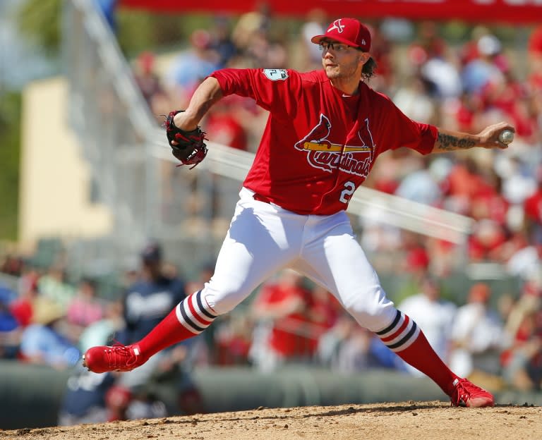 Brett Cecil of the St. Louis Cardinals delivers a pitch during a spring training game against the Atlanta Braves, at Roger Dean Stadium in Jupiter, Florida, on March 11, 2017