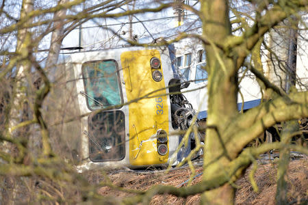 The wreckage of a passenger train is seen after it derailed in Kessel-Lo near Leuven, Belgium February 18, 2017. REUTERS/Eric Vidal