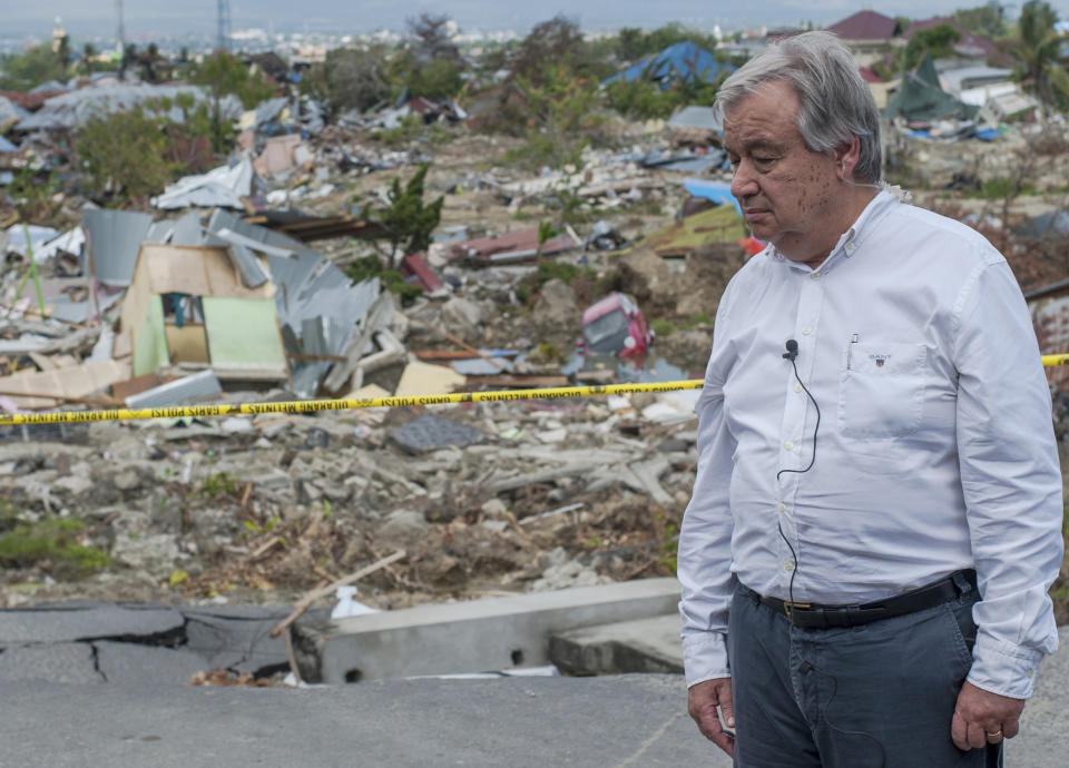 U.N. Secretary General Antonio Guterres pauses during his visit at the earthquake-devastated neighborhood of Balaroa in Palu, Central Sulawesi, Indonesia, Friday, Oct. 12, 2018. (AP Photo/Fauzy Chaniago)