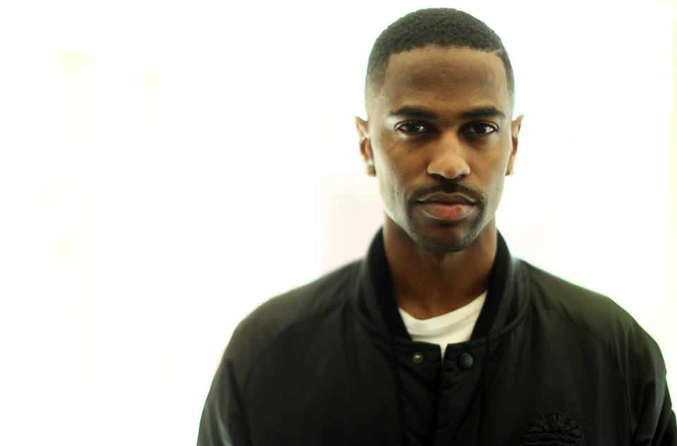In this Friday, Aug. 16, 2013 photo, Big Sean poses for a portrait at Island Def Jam in Santa Monica, Calif. The rapper put Miley Cyrus front-and-center in his recent “Fire” music video, with his face seen just briefly in the background. Then he released “Control,” featuring an explosively competitive verse from Kendrick Lamar that overshadowed his own and has become the talk of hip-hop. (Photo by Matt Sayles/Invision/AP)