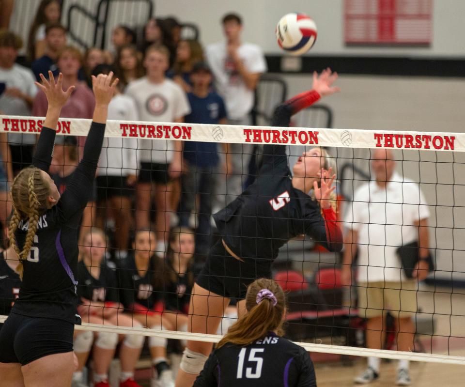 Thurston's Scout Martin goes up for a shot against Ridgeview in a volleyball match at home.