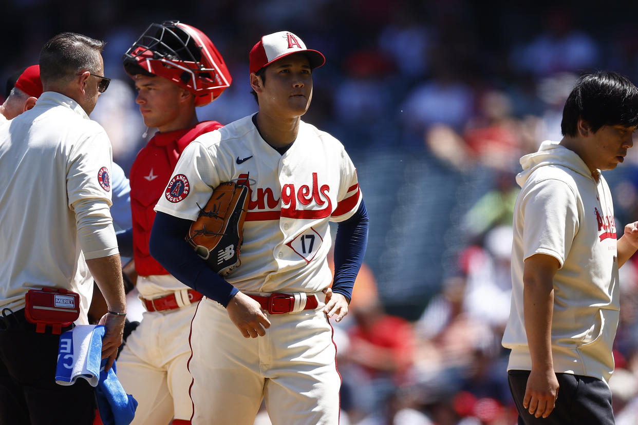 ANAHEIM, CALIFORNIA - AUGUST 23:  Shohei Ohtani #17 of the Los Angeles Angels leaves the game against the Cincinnati Reds in the second inning during game one of a doubleheader at Angel Stadium of Anaheim on August 23, 2023 in Anaheim, California. (Photo by Ronald Martinez/Getty Images)