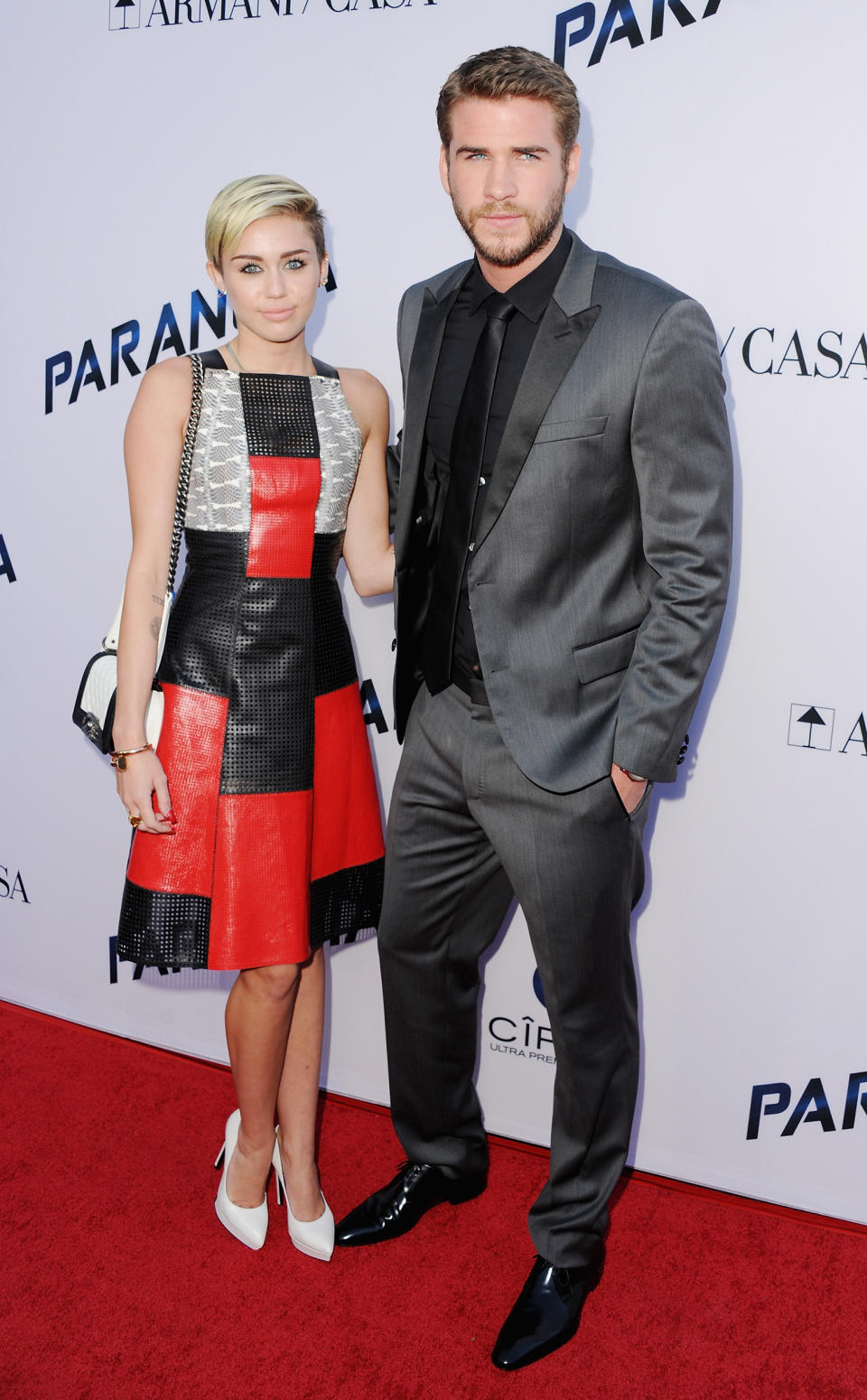 Miley Cyrus and actor Liam Hemsworth arrive at the Los Angeles Premiere 