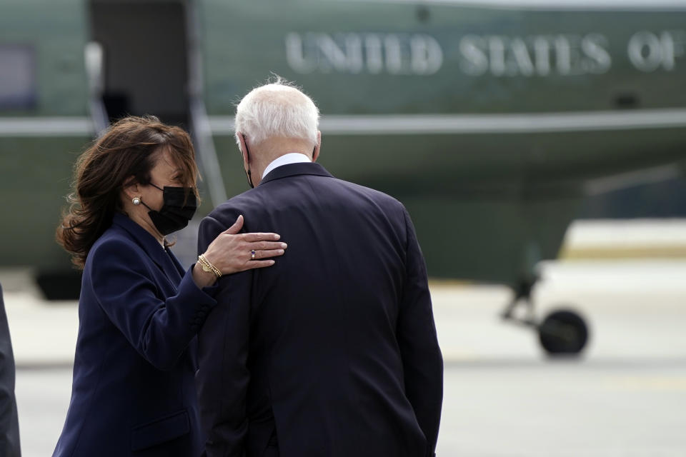 President Joe Biden talks with Vice President Kamala Harris after they arrived Friday, March 19, 2021, at Dobbins Air Reserve Base in Marietta, Ga. (AP Photo/Patrick Semansky)