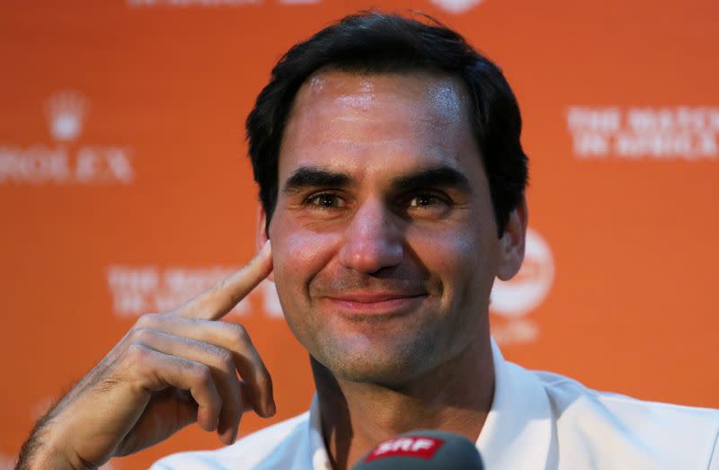 FILE PHOTO: Roger Federer speaks during a media briefing at Cape Town International Airport ahead of his exhibition tennis match against Rafael Nada