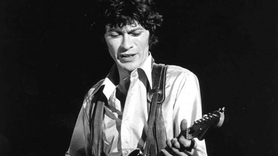 PHOTO: FILE - Robbie Robertson of the rock group 'The Band' performs onstage at 'The Last Waltz' concert with his Fender Stratocaster electric guitar, Nov 25, 1976 in San Francisco. (Larry Hulst/Getty Images, FILE)