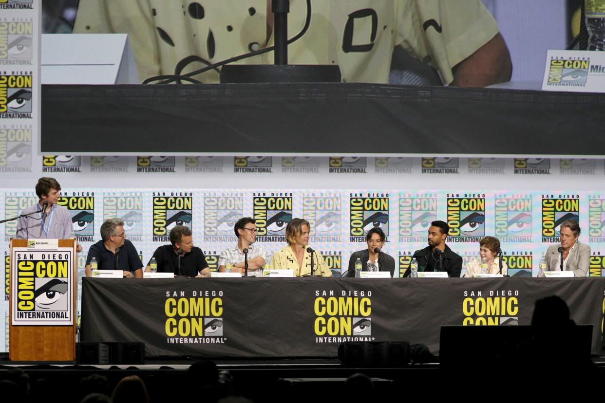 SAN DIEGO, CALIFORNIA - JULY 21: (L-R) Karl Jacobs, Jeremy Latcham, Jonathan Goldstein, John Francis Daley, Chris Pine, Michelle Rodriguez, Regé-Jean Page, Sophia Lillis, and Hugh Grant attends Paramount Pictures and eOne's Comic-Con presentation of 