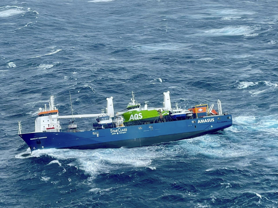 A view of the Dutch cargo ship Eemslift Hendrik in the Norwegian Sea, Monday, April 5, 2021. The vessel sent out an emergency signal after the cargo shifted. A rescue helicopter rescued several members of the crew. The ship is located about 60 nautical miles west of Alesund. (Rescue Helicopter Floro/HSS Sor-Norge / NTB via AP)