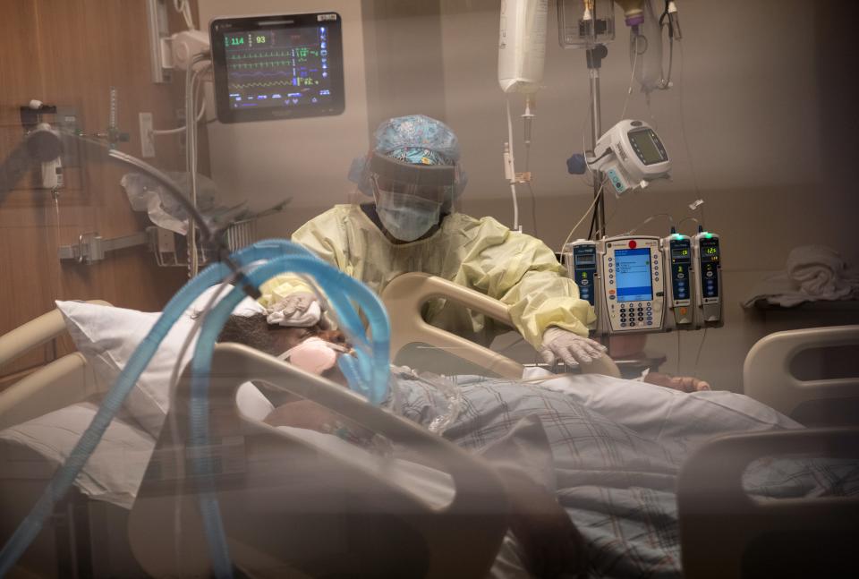 A nurse cleans a COVID-19 patient on a ventilator at a Stamford Hospital intensive care unit on April 24 in Stamford, Conn. The hospital opened additional ICUs to deal with the people suffering from the coronavirus pandemic.