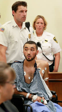 Suspect Emanuel Lopes, 20, looks on during his arraignment in the shooting deaths of Weymouth police officer Michael Chesna and a bystander, in District Courthouse in Quincy, Massachusetts, U.S., July 17, 2018. Pool/Greg Derr/The Patriot Ledger