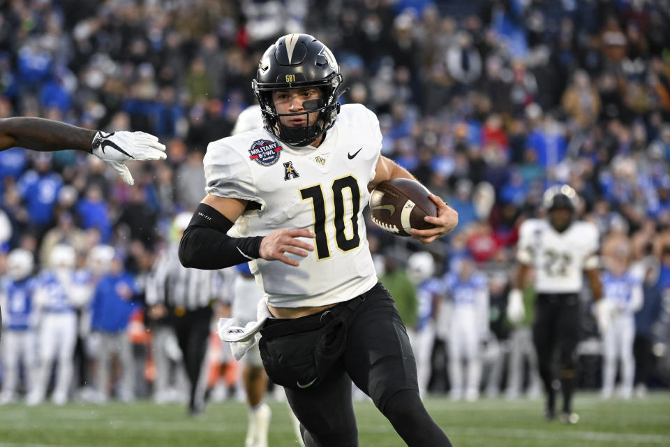 UCF quarterback John Rhys Plumlee (10) runs the ball during the second half of the Military Bowl NCAA college football game against Duke, Wednesday, Dec. 28, 2022, in Annapolis, Md. (AP Photo/Terrance Williams)